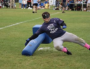 Erik Rodriguez taking down a beep baseball buzzing base.