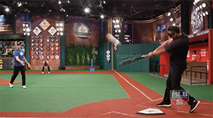 Carlos Pena swings and connects with the beep baseball.
