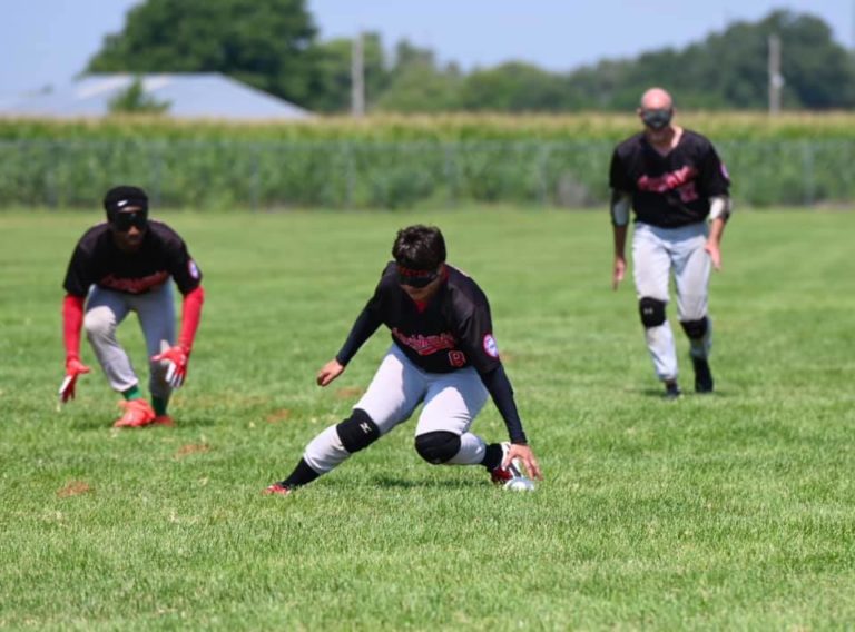 Austin Blackhawks player, Jamie Sibson, fields the ball.