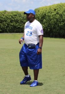 Indy Thunder head coach Darnell Booker pacing while his team is on the field.