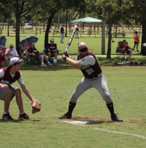 Justin Romack with BCS Outlaws ready and about to hit the ball.