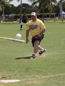 Dan Eliason with the Minnesota Millers pitching the ball, and the ball making contact with the bat.