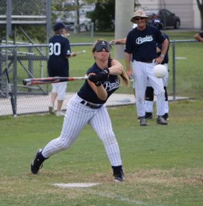 Female player for the Long Island Bombers about to make contact with the ball.