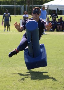 One of Indy Thunder's players tearing through a base to score a run.