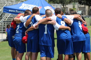 Canada's Toronto Blind Jays circling up with their arms around each other's shoulders after a game.