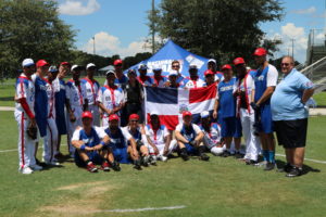 The Dominican Republic and Canadian Teams posing together after a game.