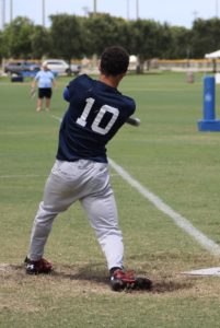 Indy Thunder's #10 Gerald Dycus making contact with the beep ball while at bat.