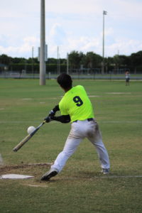 The ball is coming off the bat and about to head way out there as #9 Kaspor Chen with Taiwan makes contact.