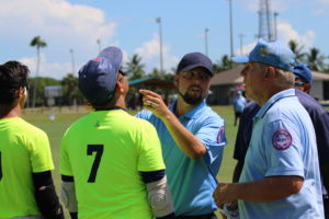 Umpires Jason Price and John Lykowski checking Taiwan's blindfolds before the 2017 championship game.