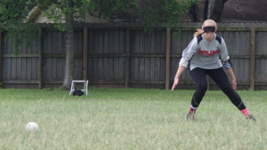 Hillary House readies herself in fielding stance to catch an incoming ball.