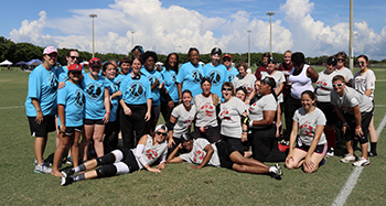 A group image of all participants from the 2017 WOOL exhibition game in West Palm Beach, Florida.