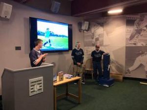 Several members of the Boston Renegades presenting to an audience at the National Baseball Hall of Fame.