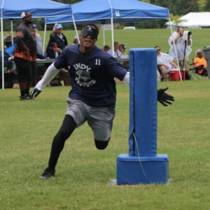 Corion White runs through the base with his arm outstretched